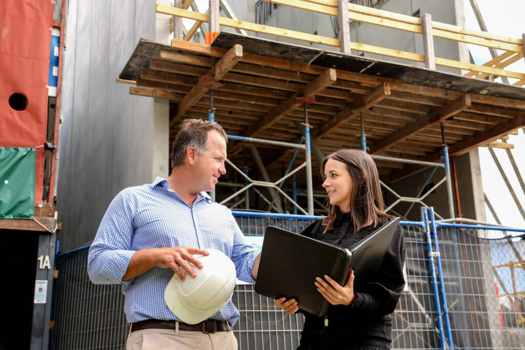 A construction supervisor speaking with a workplace lawyer